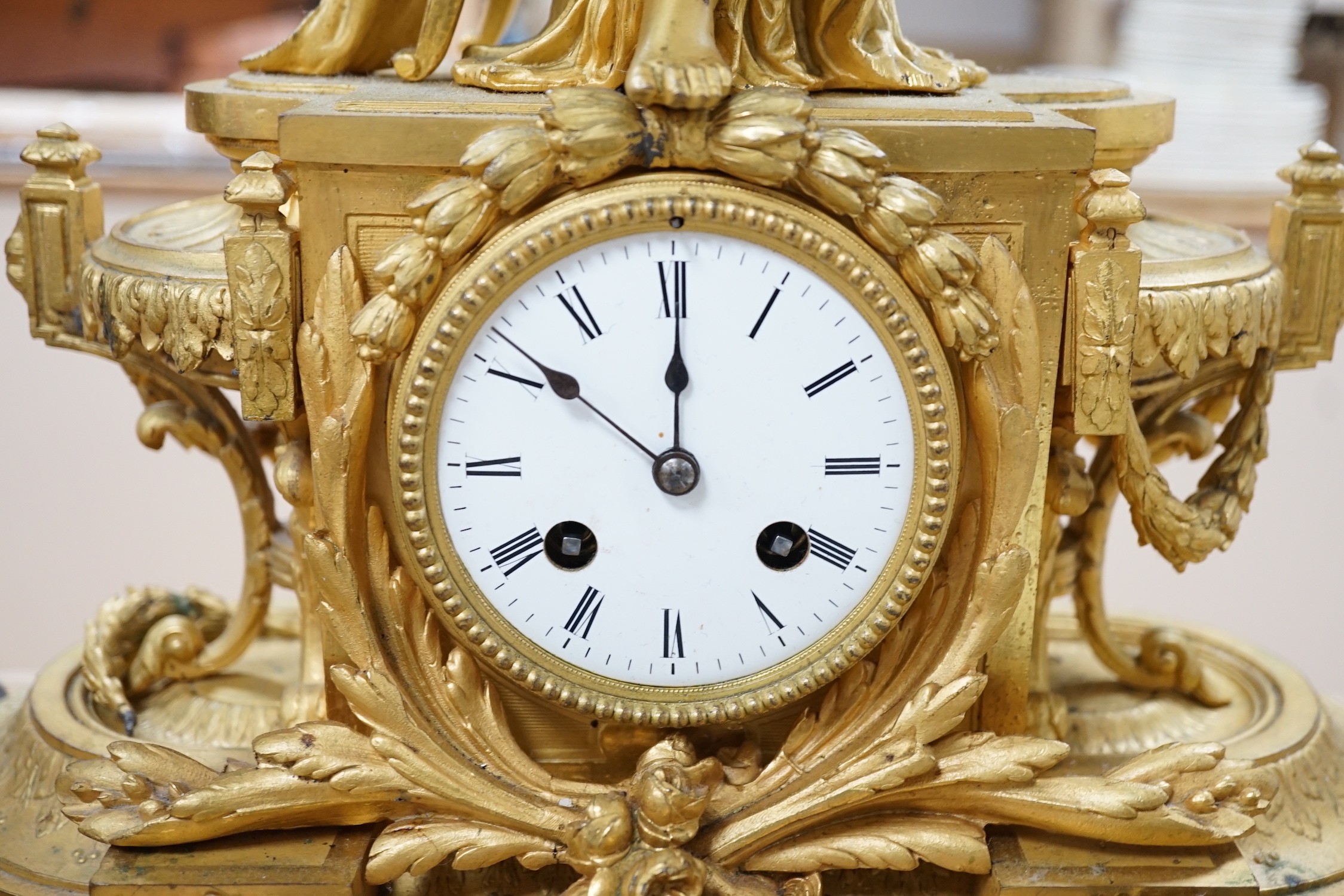 A French gilt metal figural mantel clock, 48cms high